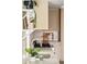 Close up of bright kitchen with white tile backsplash, stainless steel appliances, and open shelving at 2738 N Clay St, Denver, CO 80211