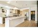 Bright kitchen features a large island, stainless appliances, and stylish pendant lighting at 2738 N Clay St, Denver, CO 80211