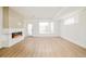 Bright living room features a sleek fireplace, hardwood floors, and natural lighting at 2738 N Clay St, Denver, CO 80211