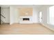 Bright living room features a sleek fireplace, hardwood floors, and natural lighting at 2738 N Clay St, Denver, CO 80211