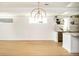 Bright living room features hardwood floors, modern light fixtures, and natural lighting at 2738 N Clay St, Denver, CO 80211