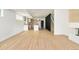 Open living space with kitchen, fireplace, hardwood floors, and modern staircase at 2738 N Clay St, Denver, CO 80211