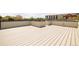 Wide angle view of a rooftop deck made of light colored composite wood with a black metal safety railing at 2738 N Clay St, Denver, CO 80211