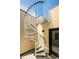 Stylish metal spiral staircase offers access to the upper level of this modern home at 2738 N Clay St, Denver, CO 80211