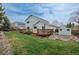 Expansive backyard features a deck, storage shed, garden beds, and lush lawn at 23955 Glenmoor Way, Parker, CO 80138