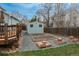 Charming backyard view featuring a storage shed, garden beds, and a deck, perfect for outdoor enjoyment at 23955 Glenmoor Way, Parker, CO 80138