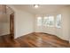 Sun-filled living room with hardwood floors and large windows at 23955 Glenmoor Way, Parker, CO 80138