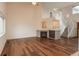 Bright living room with hardwood floors, fireplace, and staircase leading to an upper level at 23955 Glenmoor Way, Parker, CO 80138