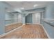 Large workout room with wood floor, ample mirror space, and an open concept layout at 7949 S Blackstone Pkwy, Aurora, CO 80016