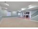 Spacious finished basement featuring updated lighting, light blue walls, and a kitchenette space at 7949 S Blackstone Pkwy, Aurora, CO 80016