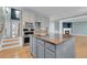 Kitchen with granite island, stainless appliances, and an open design to the living room at 7949 S Blackstone Pkwy, Aurora, CO 80016