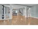 Open-concept living area showcasing kitchen, dining, and living spaces with hardwood floors at 7949 S Blackstone Pkwy, Aurora, CO 80016