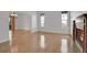 Open-concept room with hardwood floors, a modern fireplace, and sliding glass doors leading to the patio at 7949 S Blackstone Pkwy, Aurora, CO 80016
