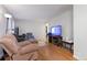 Bright living room boasting hardwood floors, comfortable seating, and natural light at 3390 S Elm St, Denver, CO 80222