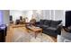 Spacious living area with hardwood flooring and comfortable furnishings at 3390 S Elm St, Denver, CO 80222