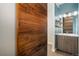 Updated bathroom featuring wood vanity, shelving, and modern fixtures at 4144 Tennyson St # 10, Denver, CO 80212