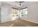 Bright bedroom featuring large windows, neutral paint, and ceiling fan at 4144 Tennyson St # 10, Denver, CO 80212