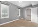 Bedroom with closet, neutral walls, carpet, and natural light at 4144 Tennyson St # 10, Denver, CO 80212