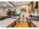 Kitchen featuring a quartz countertop, stainless steel appliances, and open shelving for storage at 4144 Tennyson St # 10, Denver, CO 80212