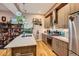Well-appointed kitchen with stainless steel appliances, quartz countertops, and greenery at 4144 Tennyson St # 10, Denver, CO 80212