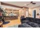 Inviting living area with hardwood floors, plush seating, and views into a stylish kitchen at 4144 Tennyson St # 10, Denver, CO 80212