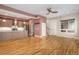 Open-concept living space featuring a modern kitchen, hardwood floors, and great natural light at 4144 Tennyson St # 10, Denver, CO 80212