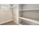 Spacious walk-in closet with shelving and a window at 4144 Tennyson St # 10, Denver, CO 80212
