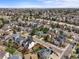 Aerial view of neighborhood with mature trees and well-manicured lawns at 9408 Harvard Dr, Highlands Ranch, CO 80130