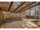 Wooden deck and pergola with built in seating, surrounded by trees and the privacy fence at 9408 Harvard Dr, Highlands Ranch, CO 80130