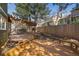 Backyard wooden deck area with pergola and built in seating, surrounded by privacy fence at 9408 Harvard Dr, Highlands Ranch, CO 80130