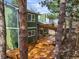 A spacious, newly-stained wooden deck featuring a pergola creates an inviting outdoor living space at this green home at 9408 Harvard Dr, Highlands Ranch, CO 80130