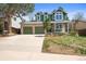 Charming two-story home with a large driveway, three car garage, and well-manicured lawn at 9408 Harvard Dr, Highlands Ranch, CO 80130