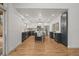 Well-lit kitchen features dark cabinets, white countertops, and stainless-steel appliances, with center island at 9408 Harvard Dr, Highlands Ranch, CO 80130