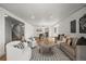 Spacious living area flows into the dining room, perfect for entertaining guests at 9408 Harvard Dr, Highlands Ranch, CO 80130