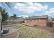 A brick home with a nice yard and a wooden deck at 1632 S Josephine St, Denver, CO 80210