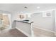 Basement wet bar with modern finishes and carpeted floors at 1632 S Josephine St, Denver, CO 80210