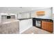 Basement with a wet bar, fireplace, and neutral carpet at 1632 S Josephine St, Denver, CO 80210