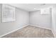 Bedroom with carpet flooring, large windows, and neutral walls provide natural light and a relaxing space at 1632 S Josephine St, Denver, CO 80210
