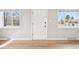Bright entryway featuring fresh paint, hardwood floors, and natural light from nearby windows at 1632 S Josephine St, Denver, CO 80210