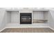 Modern fireplace in a finished basement with custom built-ins at 1632 S Josephine St, Denver, CO 80210