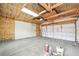 The unfinished garage has exposed beams and insulated walls at 1632 S Josephine St, Denver, CO 80210