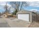 Garage exterior with gray siding and a white garage door at 1632 S Josephine St, Denver, CO 80210
