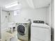 Laundry room features a washer, dryer, and utility sink at 1632 S Josephine St, Denver, CO 80210