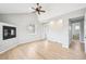Open living area with a fireplace, hardwood floors, and access to other rooms at 1632 S Josephine St, Denver, CO 80210