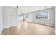 Spacious living room with hardwood floors, large windows, and a view of the front yard at 1632 S Josephine St, Denver, CO 80210