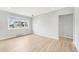 Bright living area with hardwood floors and a large window overlooking the neighborhood at 1632 S Josephine St, Denver, CO 80210