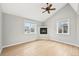 Living room with vaulted ceiling, hardwood floors, and a cozy fireplace at 1632 S Josephine St, Denver, CO 80210
