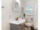 Bathroom with modern vanity, new fixtures, and window at 3061 S Marion St, Englewood, CO 80113