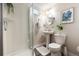Clean and functional bathroom featuring a glass-enclosed shower, pedestal sink, and modern fixtures at 3061 S Marion St, Englewood, CO 80113