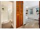 Bathroom and bedroom featuring new floors and fresh paint at 3061 S Marion St, Englewood, CO 80113